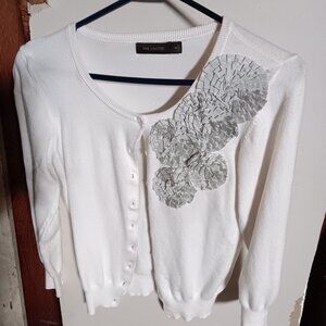 The limited cream sweater with floral pattern